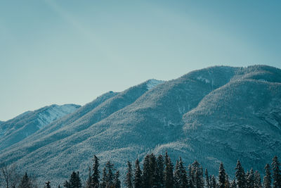 Scenic view of mountains against clear blue sky