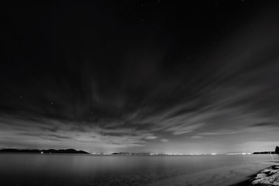 Scenic view of sea against sky at night