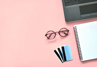 Directly above shot of eyeglasses on book