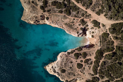 Aerial view of sea by land