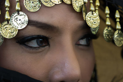 Cropped image of mid adult woman wearing headdress