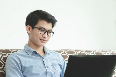 Portrait of young man sitting