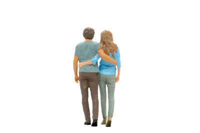 Rear view of couple against white background