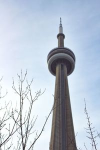Low angle view of building against cloudy sky