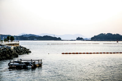 Scenic view of calm sea against clear sky