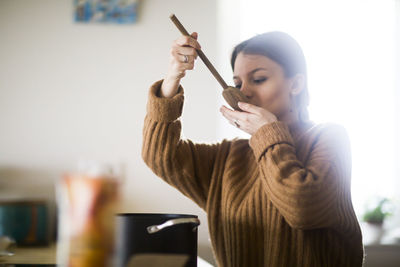 Young woman cooking in the kitchen