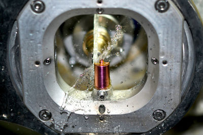 Milling abutment close-up. cutting and milling of titanium abutment crown base for dental implant