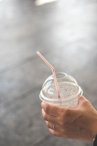 Close-up of hand holding drink