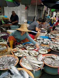 People at market stall