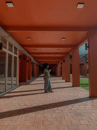 Rear view of woman walking on street