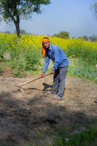 Full length of man standing on field