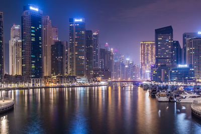 Illuminated buildings in city at night