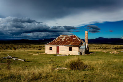 House on field against sky