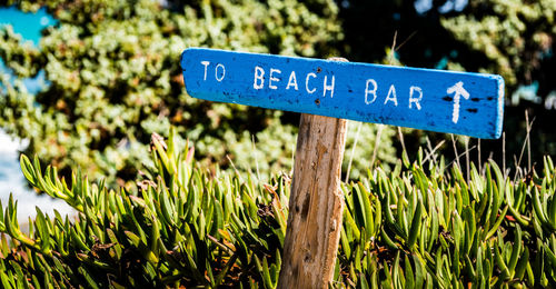 Close-up of information sign on field