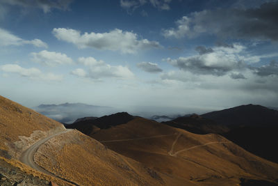 Road through the mountains and clouds