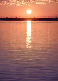 Scenic view of lake at sunset