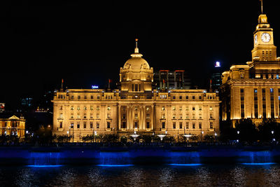 Illuminated buildings in city at night