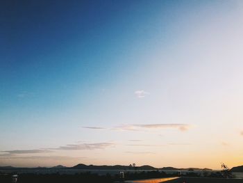 Scenic view of landscape against sky during sunset
