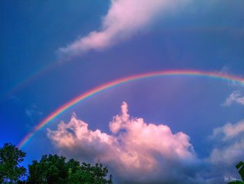 Low angle view of rainbow in sky