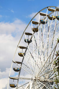 Low angle view of ferris wheel against sky