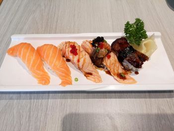 High angle view of fish in plate on table