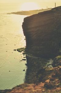 Scenic view of beach against sky during sunset