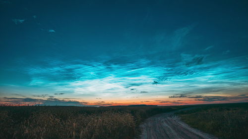 Scenic view of landscape against sky at night