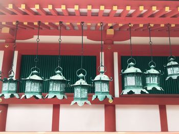 Green lanterns hanging in row