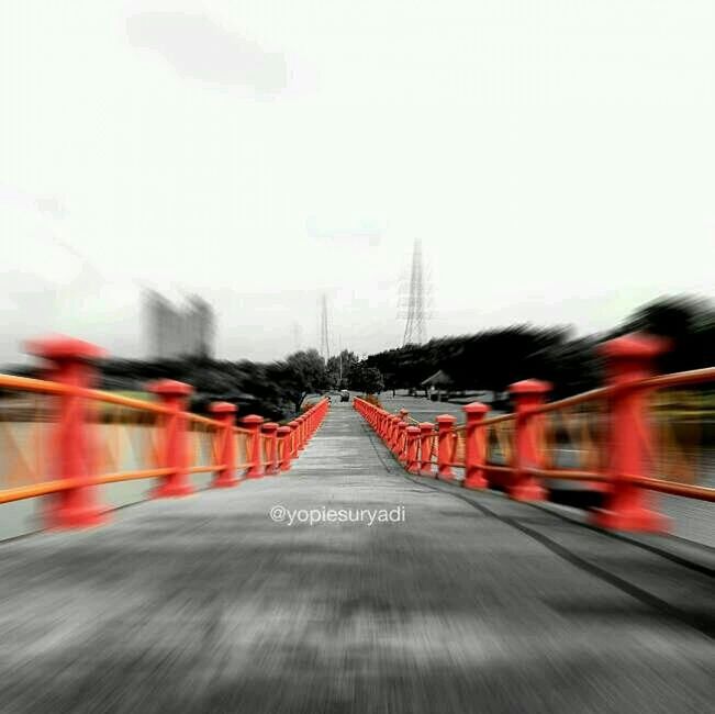 transportation, the way forward, road, red, road marking, street, clear sky, diminishing perspective, built structure, architecture, sky, copy space, vanishing point, blurred motion, surface level, outdoors, empty, multi colored, car