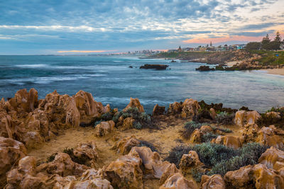 Scenic view of sea against cloudy sky