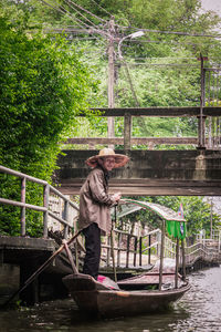 Full length of man on boat in canal