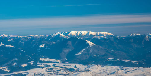 Scenic view of snowcapped mountains against sky