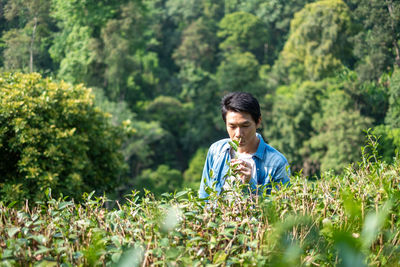 Portrait of young man on land