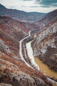 Beautiful picture of the canyon in serbia, with river and the highway in the middle. dramatic sky