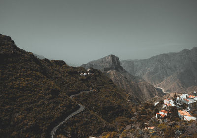 Panoramic view of landscape and mountains against clear sky