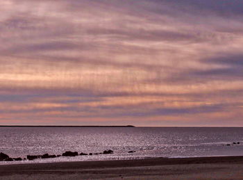 Scenic view of sea against sky at sunset