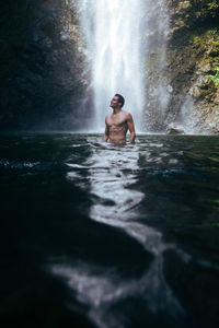 Rear view of woman in water