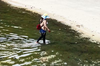 Boy standing in water