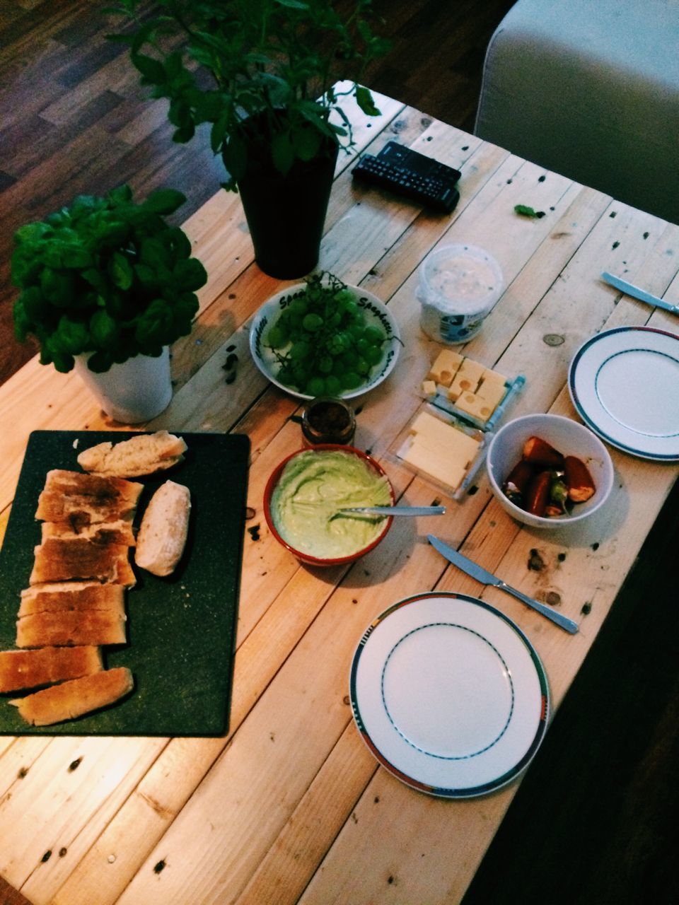 table, indoors, still life, high angle view, food and drink, freshness, wood - material, food, cutting board, healthy eating, close-up, directly above, wooden, no people, plate, vegetable, wood, kitchen knife, refreshment, variation