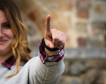 Portrait of smiling woman pointing