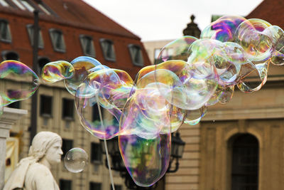 Soap bubbles and sculpture in center of berlin.