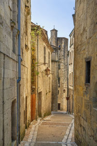 Narrow alley amidst buildings in city