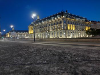 View of illuminated street at night