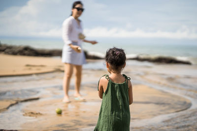 Boy standing on beach