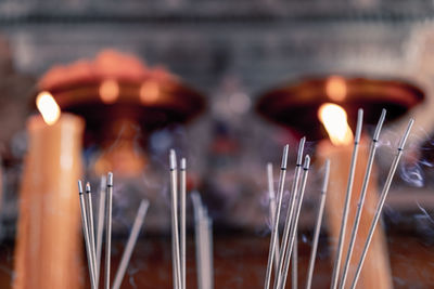 Close-up of burning candles