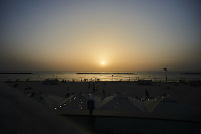 Scenic view of sea against clear sky during sunset