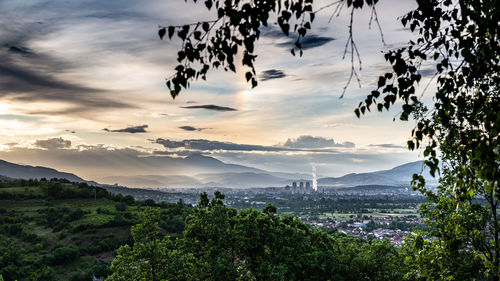 Scenic view of landscape against sky at sunset