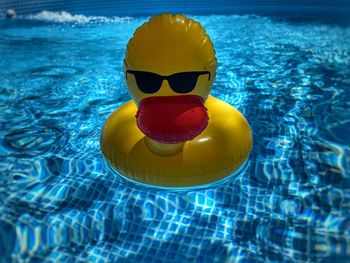 High angle view of yellow floating on swimming pool