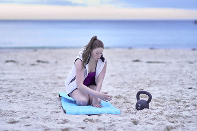 Woman exercising at beach