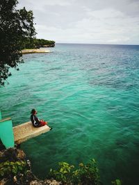 Woman swimming in sea